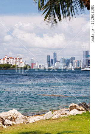 Modern skyline of Miami with towering skyscrapers, tropical vibe, and waterfront views 132668399