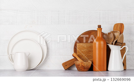 Kitchen utensils and cutting boards on table Kitchen utensils and cutting boards on table 132669096