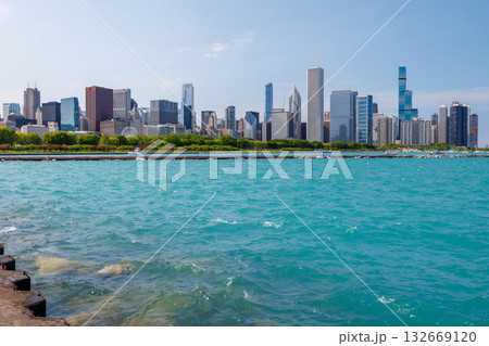 Bright and sunny view of downtown Chicago with the shimmering Michigan lake in the foreground 132669120
