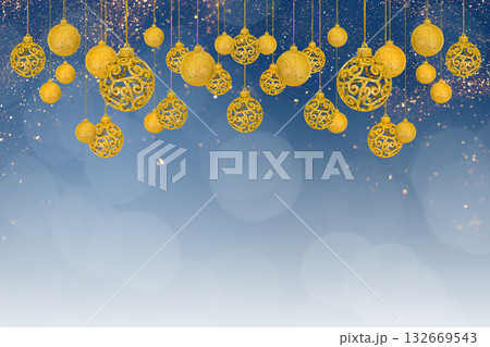 Christmas tree baubles on blue background with white snow and golden lights. Festive winter holiday background. Design with copy space for greeting card, text, advertising, banner, invitation Christmas tree baubles on blue background with white snow and golden lights. Festive winter holiday background. Design with copy space for greeting card, text, advertising, banner, invitation 132669543