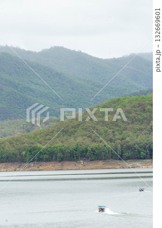 Tourist Boat Cruising on Lake in Thailand Tourist Boat Cruising on Lake in Thailand 132669601