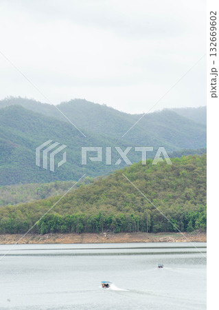 Tourist Boat Cruising on Lake in Thailand 132669602