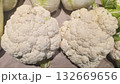 Cauliflower in large boxes on the supermarket shelf. Ready for sale. 132669656