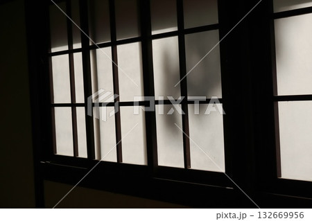 Dramatic Backlit Window Grid Silhouette Creating Geometric Pattern 132669956