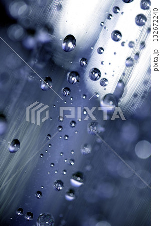 Close up of abstract floating bubbles water droplets condensation rain on a glass transparent bokeh background Close up of abstract floating bubbles water droplets condensation rain on a glass transparent bokeh background 132672240