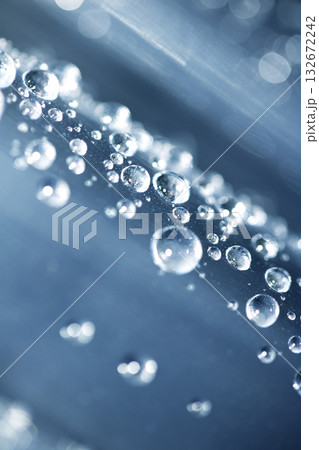 Close up of abstract floating bubbles water droplets condensation rain on a glass transparent bokeh background 132672242