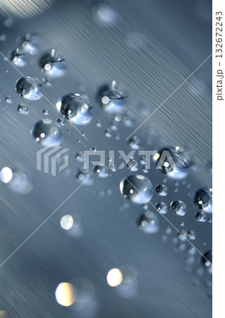 Close up of abstract floating bubbles water droplets condensation rain on a glass transparent bokeh background 132672243