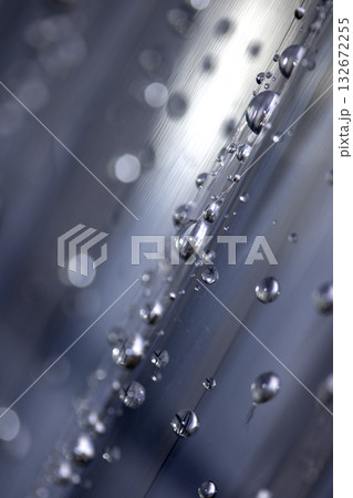 Close up of abstract floating bubbles water droplets condensation rain on a glass transparent bokeh background Close up of abstract floating bubbles water droplets condensation rain on a glass transparent bokeh background 132672255