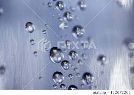 Close up of abstract floating bubbles water droplets condensation rain on a glass transparent bokeh background 132672263