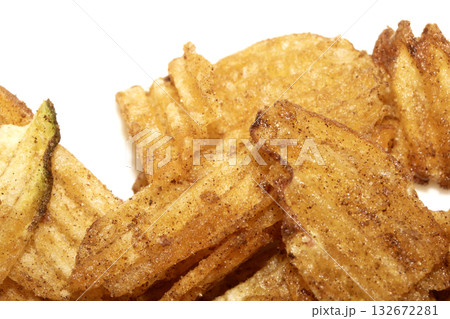 Close up of fresh crinkle cut seasoned crisps snack Close up of fresh crinkle cut seasoned crisps snack 132672281