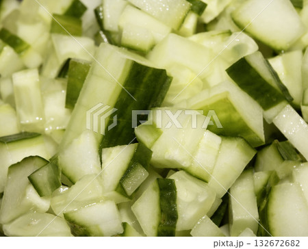 Close up of sliced chopped cucumber pieces Close up of sliced chopped cucumber pieces 132672682