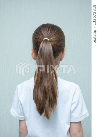 A little girl at a hair salon. 132672819