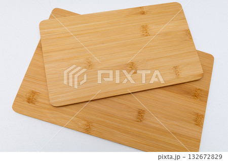 Creative layout of cutting boards on a white background. Round Cutting Board and Square Cutting Board. 132672829