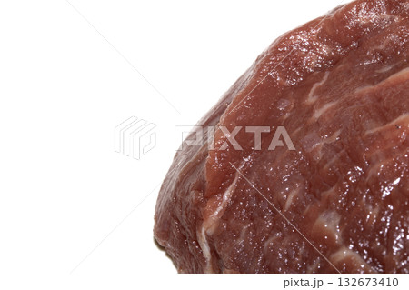 Close up of raw meat steak cut beef on a white background Close up of raw meat steak cut beef on a white background 132673410
