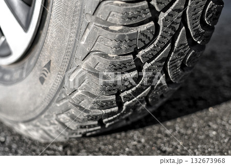 Wheel with winter tyre on the asphalt close up 132673968