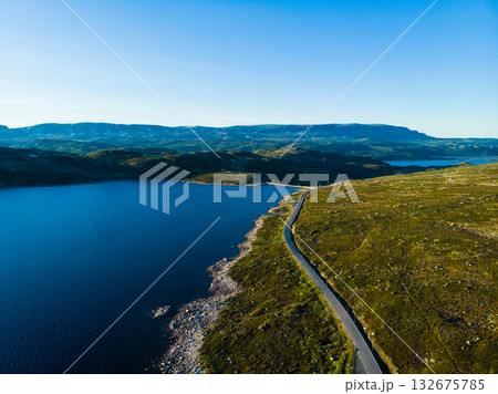 Road crossing Hardangervidda plateau, Norway. Aerial view. Road crossing Hardangervidda plateau, Norway. Aerial view. 132675785