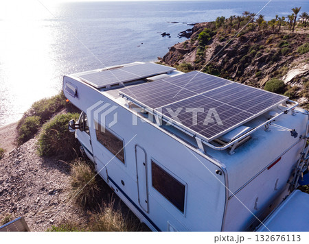 Caravan with solar panels on roof camp on sea, Spain. Aerial view. Caravan with solar panels on roof camp on sea, Spain. Aerial view. 132676113