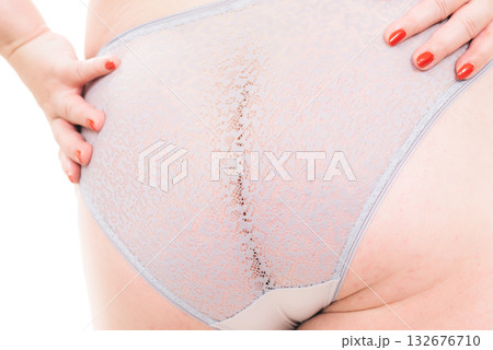 Plus size woman in lingerie back view. 132676710