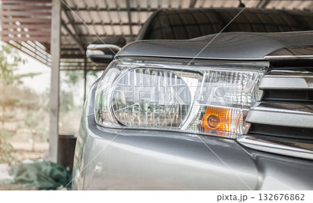 Details about headlights of a Gray modern car close up. Rear lights of a new sports car. Details about headlights of a Gray modern car close up. Rear lights of a new sports car. 132676862