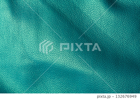 Green genuine leather as a background macro photo. 132676949