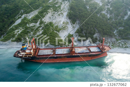 Aerial view of an abandoned bulk-carrier dry cargo ship washed ashore after a storm 132677062