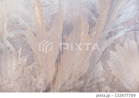 Abstract frost patterns on glass with soft pastel tones and delicate ice crystals 132677789