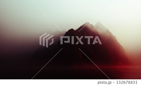 Misty mountain peak emerges from calm water during twilight Misty mountain peak emerges from calm water during twilight 132678831