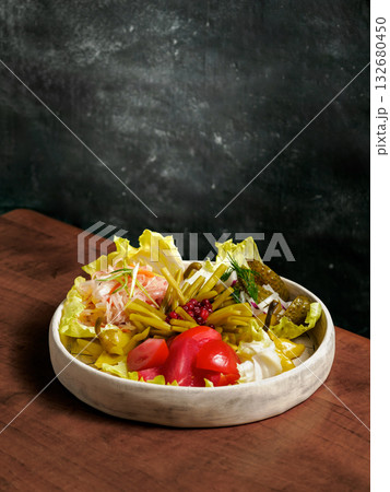 Assorted snacks from fermented cabbage, cucumbers and tomatoes, green bean. Decorated cranberry. Fermented healthy food concept. Pickled cucumbers, marinated tomatoes Vertical. Assorted snacks from fermented cabbage, cucumbers and tomatoes, green bean. Decorated cranberry. Fermented healthy food concept. Pickled cucumbers, marinated tomatoes Vertical. 132680450