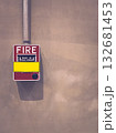 Red fire alarm on concrete wall in modern industrial interior. 132681453