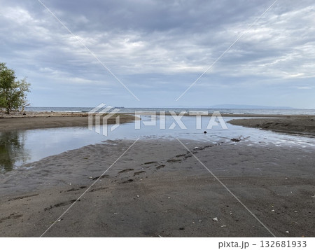 Sandbar is formed at low tide of water waves gently caress warm sand 132681933