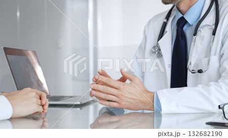 Doctor consulting patient about healthcare, discussing diagnosis, offering medical advice in clinic. Medicine, healthcare and science concept Doctor consulting patient about healthcare, discussing diagnosis, offering medical advice in clinic. Medicine, healthcare and science concept 132682190