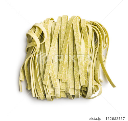 Green tagliatelle pasta isolated on white background. 132682537