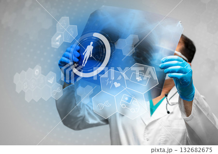 Medical professional examines digital health information with advanced tech interface Medical professional examines digital health information with advanced tech interface 132682675