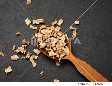 Pieces of dry various vegetables in a wooden spoon Pieces of dry various vegetables in a wooden spoon 132682957