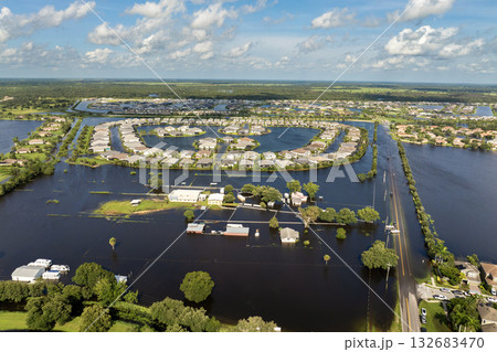 Hurricane rainfall flooded road. Drowned car on city street in Florida residential area. Consequences of hurricane natural disaster Hurricane rainfall flooded road. Drowned car on city street in Florida residential area. Consequences of hurricane natural disaster 132683470