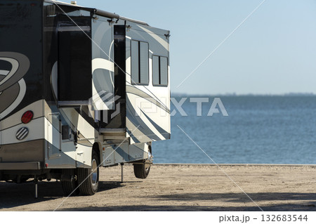 Florida travel destination. Motorhome recreational vehicle on seaside. 132683544