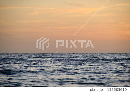 Dramatic red ocean waves at sunset with soft evening sea dark water 132683610