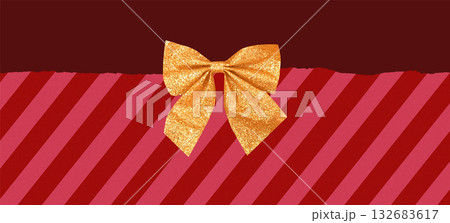 Background with Christmas candy-like striped textured paper and golden bow 132683617