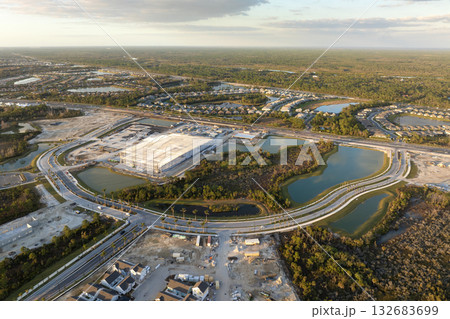 Construction in new developing suburban area. Development of residential housing in American suburbs. Real estate market in the USA Construction in new developing suburban area. Development of residential housing in American suburbs. Real estate market in the USA 132683699