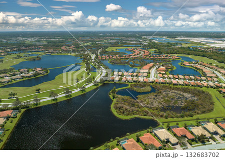 Consequences of natural disaster. Heavy flood with high water surrounding residential houses after hurricane Ian rainfall in Florida residential area 132683702