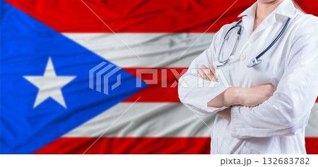 Doctor with crossed arms on Puerto Rico flag. Puerto Rico health and care concept. Female doctor on Puerto Rico flag Doctor with crossed arms on Puerto Rico flag. Puerto Rico health and care concept. Female doctor on Puerto Rico flag 132683782
