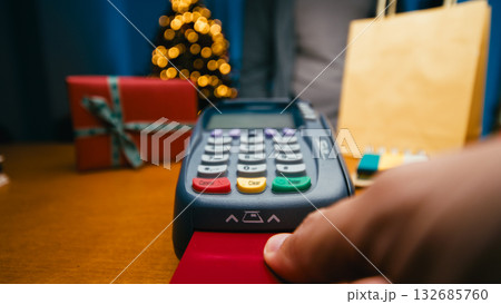 Hand Inserting The Red Credit Card Inside The Terminal Hand Inserting The Red Credit Card Inside The Terminal 132685760