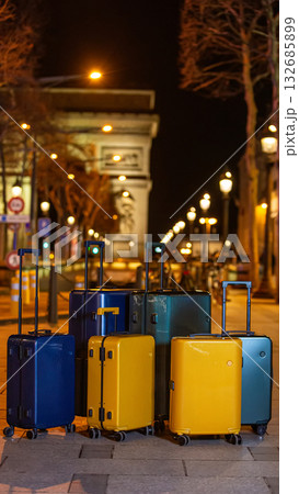 A collection of luggage on a city street. A collection of luggage on a city street. 132685899