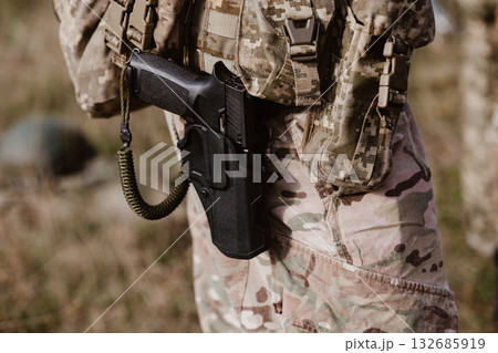 A soldier's pistol in a tactical holster. A soldier's pistol in a tactical holster. 132685919