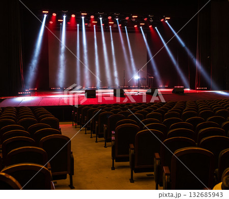 A spotlight on an empty stage. 132685943