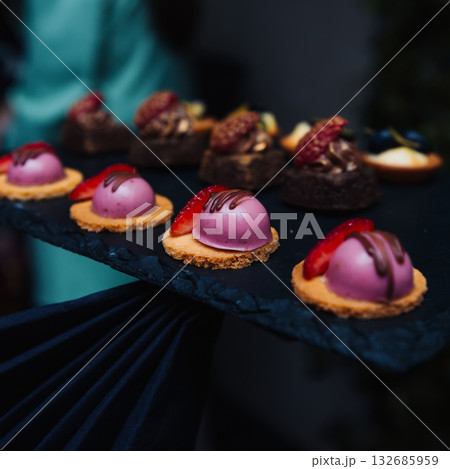 Elegant gourmet desserts on a slate tray 132685959