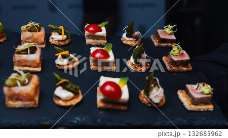 Gourmet appetizers on a slate tray 132685962
