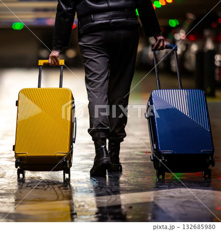 A traveler with colorful luggage. A traveler with colorful luggage. 132685980