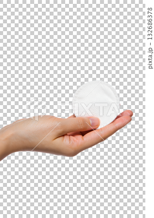 Hand presenting clean, white cosmetic cotton pad isolated on transparent background. Represents skincare, makeup removal, facial routine, personal hygiene concepts Hand presenting clean, white cosmetic cotton pad isolated on transparent background. Represents skincare, makeup removal, facial routine, personal hygiene concepts 132686378