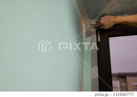 The Wall Repair Process Involves Properly Using Spackling Paste for a Quality Finish 132686777